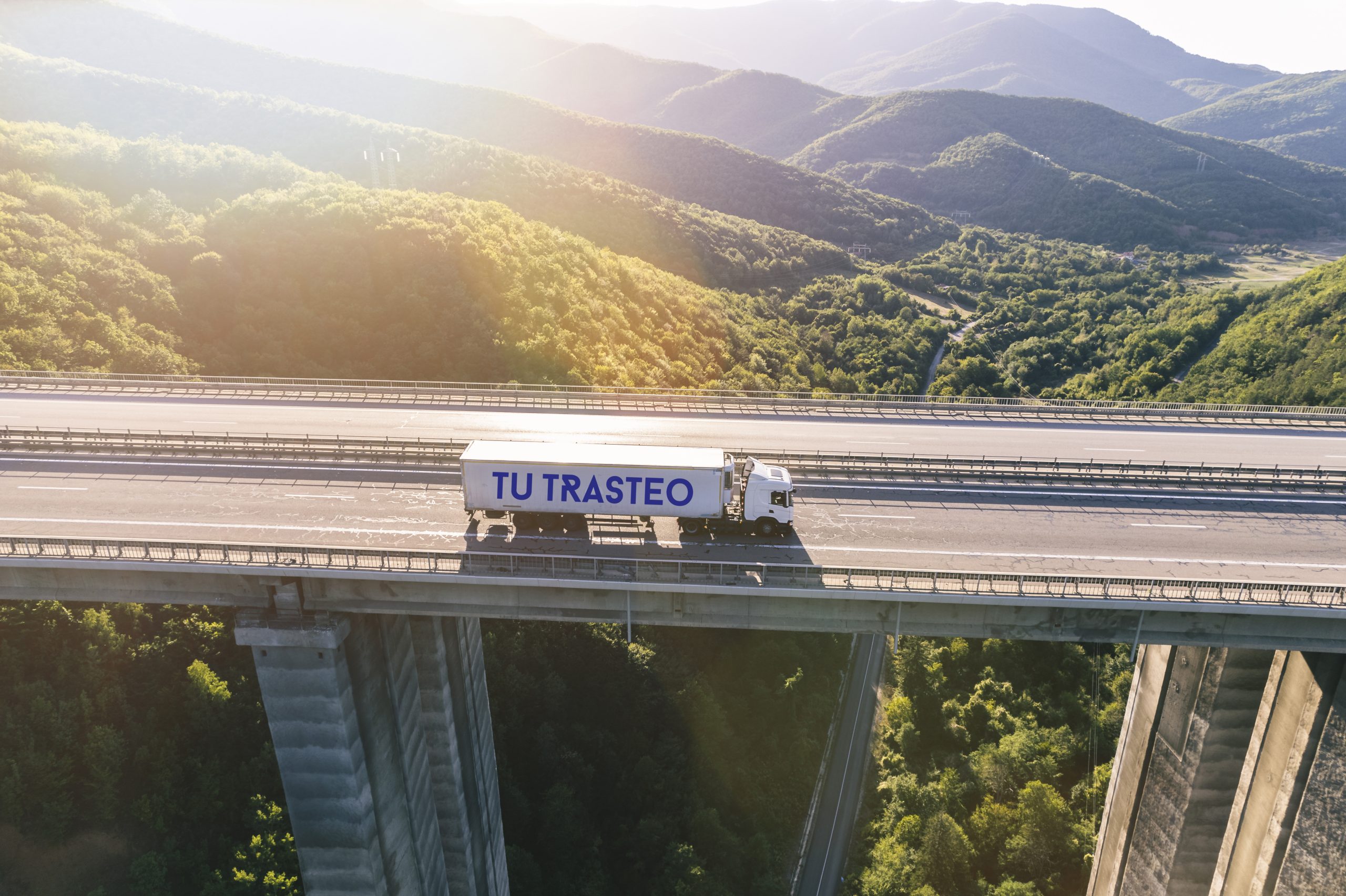 trucks-highway-mountain-sunset